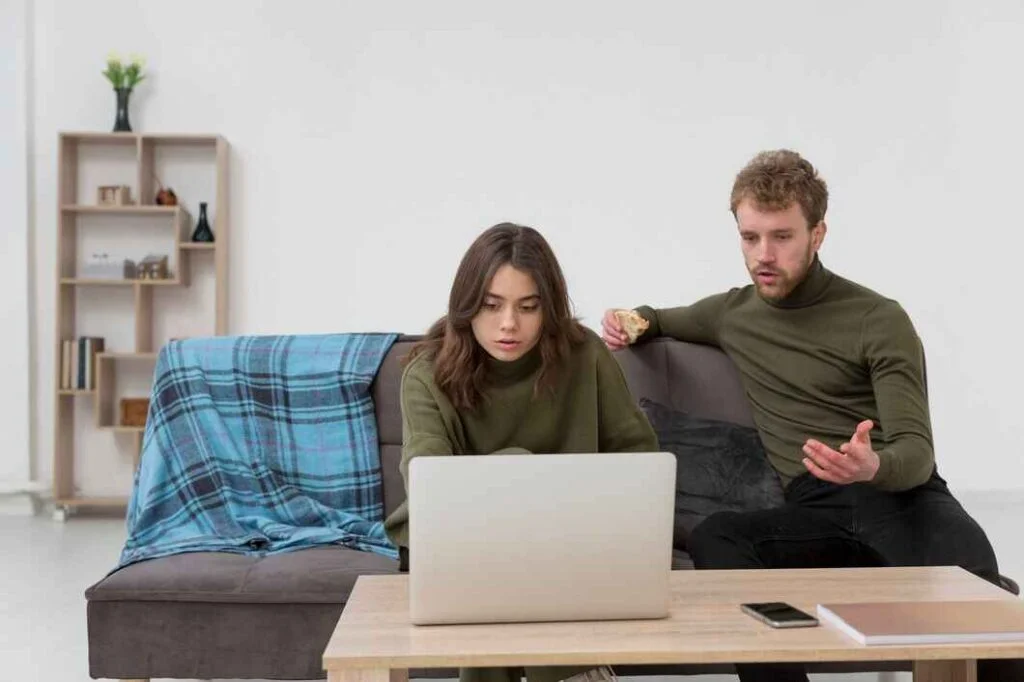 man-woman-looking-laptop